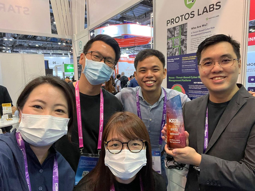 Melissa (front row, centre), with her team at Protos Labs
